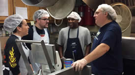 A circle of volunteers discussing the day's tasks