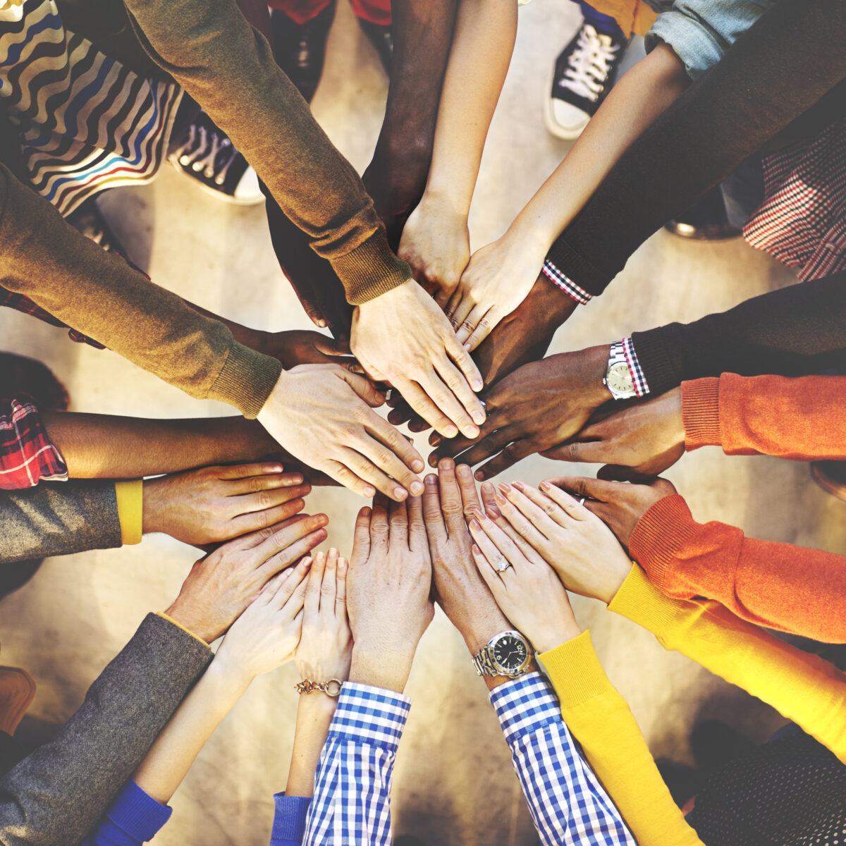 Multicultural hands coming together