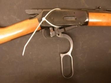 Shotgun with zip tie for safety, Firearm Evidence Packaging 3