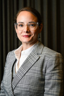 Woman with suit, glasses