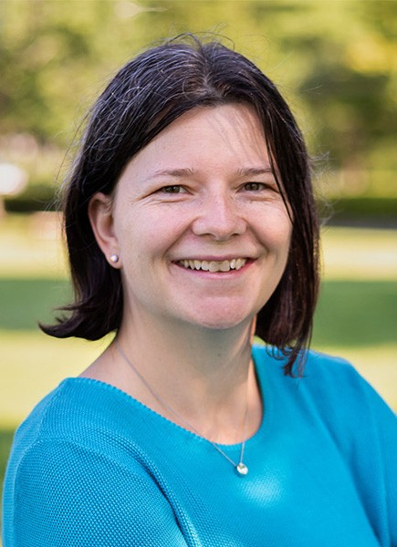 woman, headshot, green shirt